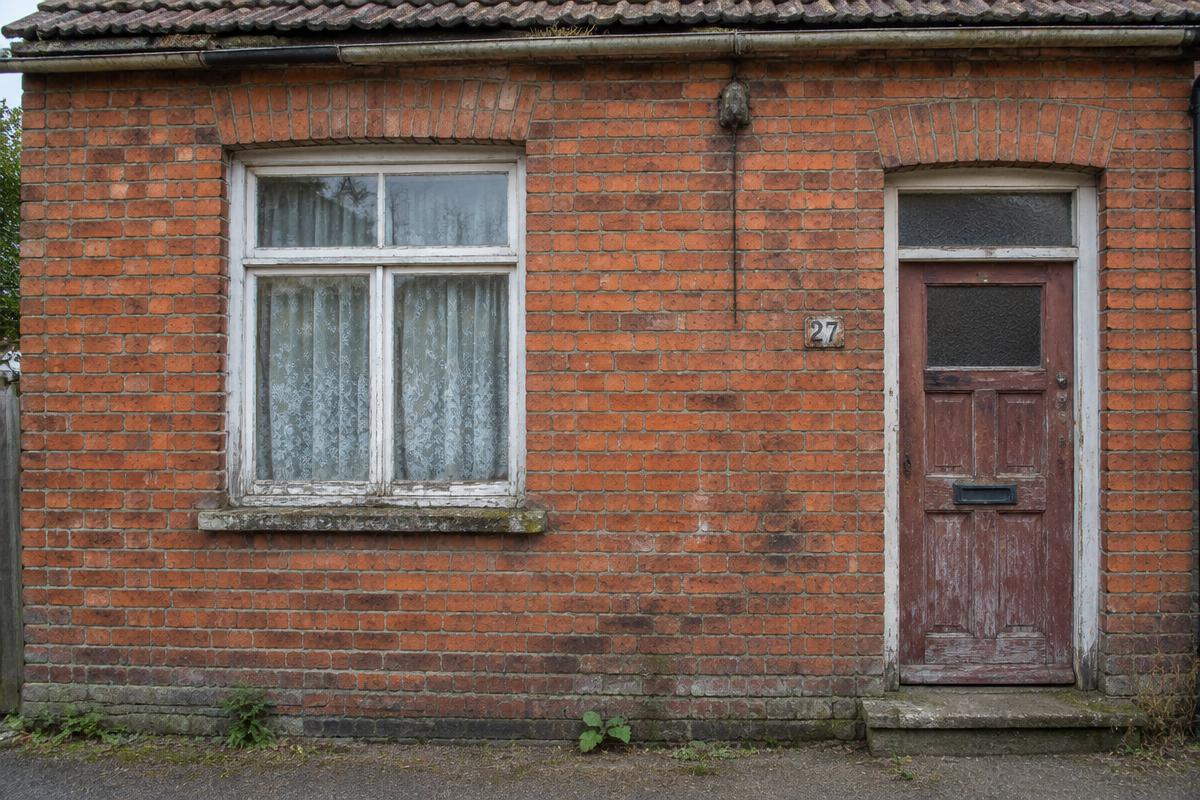 Brick home before (placeholder)